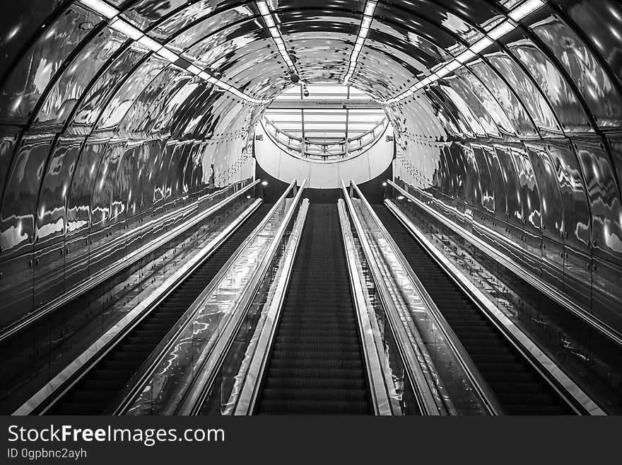 Escalators leading up from a subway station. Escalators leading up from a subway station.