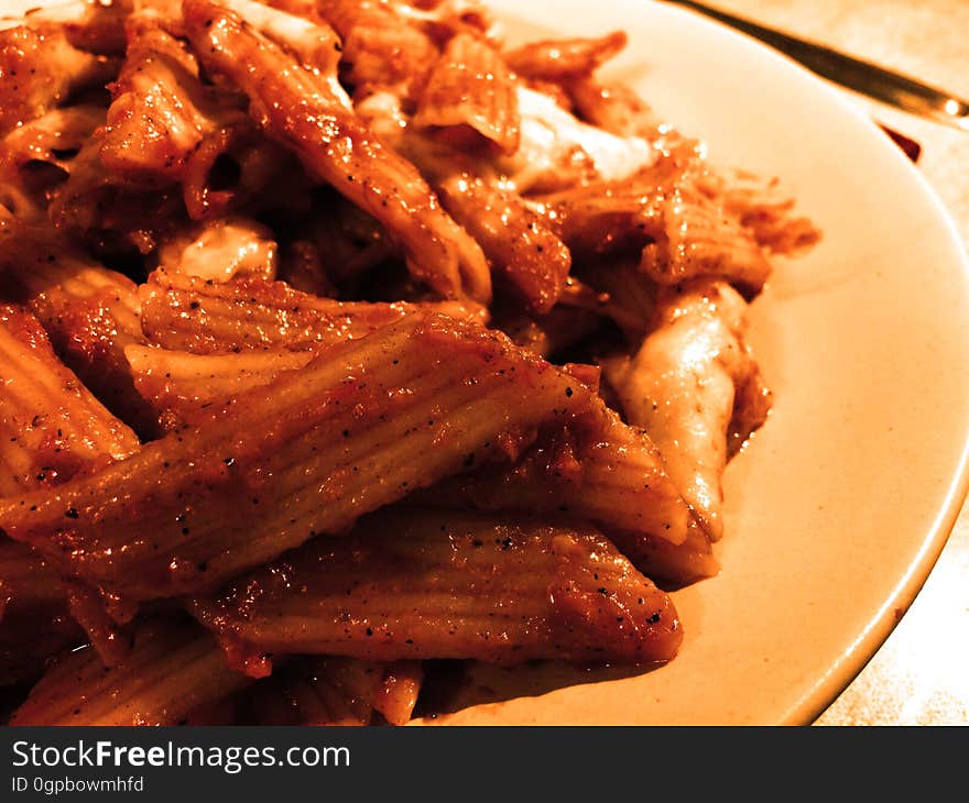 Closeup of pasta with a spicy tomato sauce.