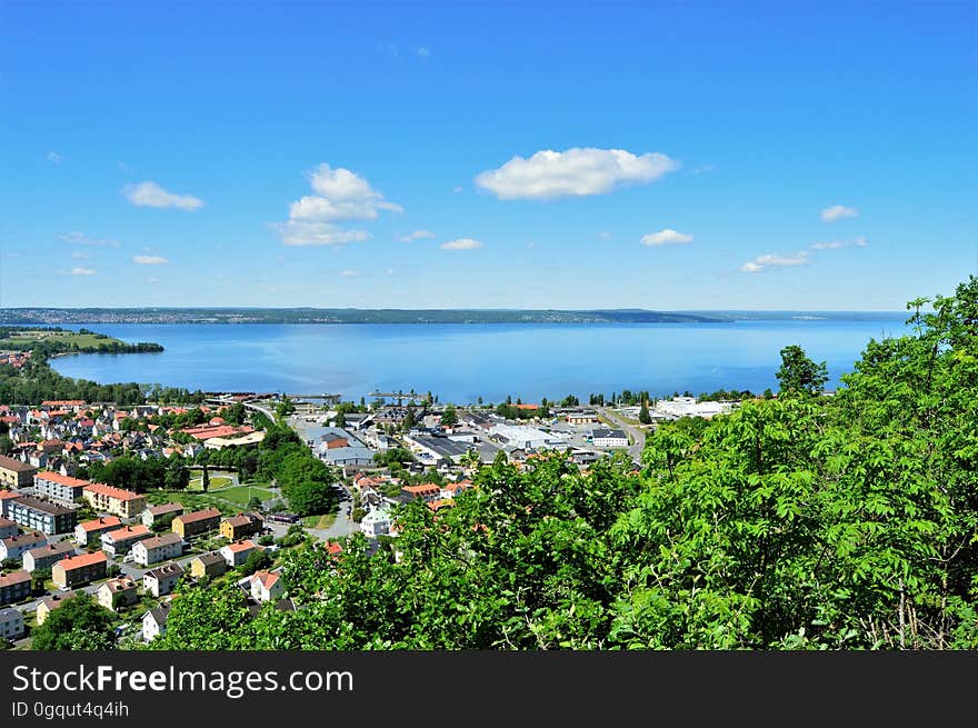 A view overlooking a tropical town and its bay. A view overlooking a tropical town and its bay.