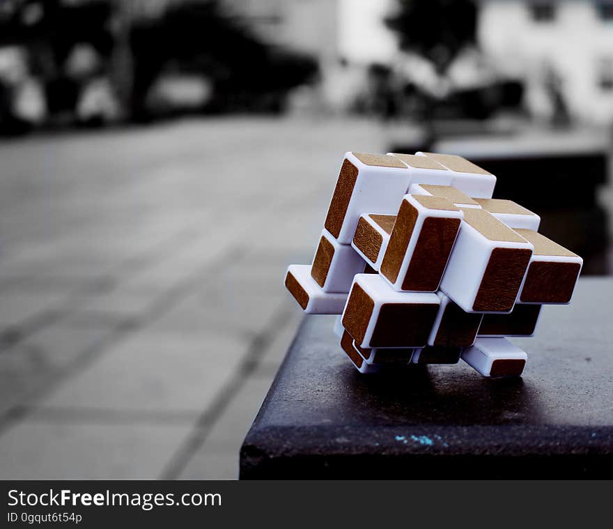 Closeup of a rubik's cube on a bench. Closeup of a rubik's cube on a bench.