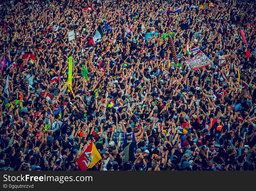 Aerial view of crowd celebrating at festival on sunny day. Aerial view of crowd celebrating at festival on sunny day.