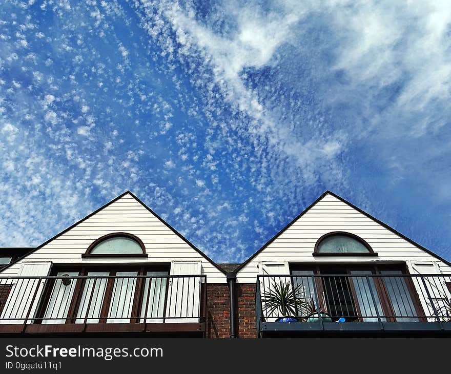 Housetops from a low angle and the sky in the background. Housetops from a low angle and the sky in the background.