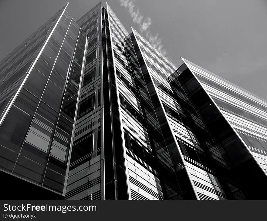 A monochrome of a high rise office building from a low angle.