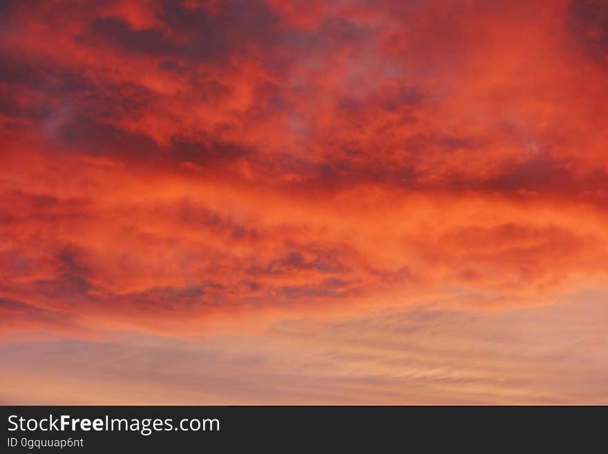 Bright orange and yellow glow in the clouds at sunset. Bright orange and yellow glow in the clouds at sunset.