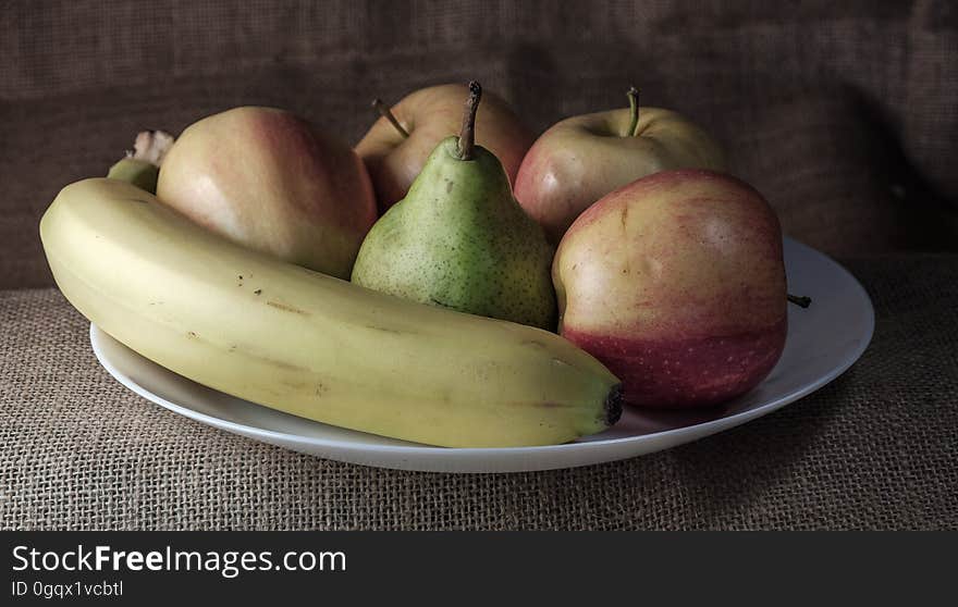 Fruit plate on the table on a background of linen fabric. Fruit plate on the table on a background of linen fabric