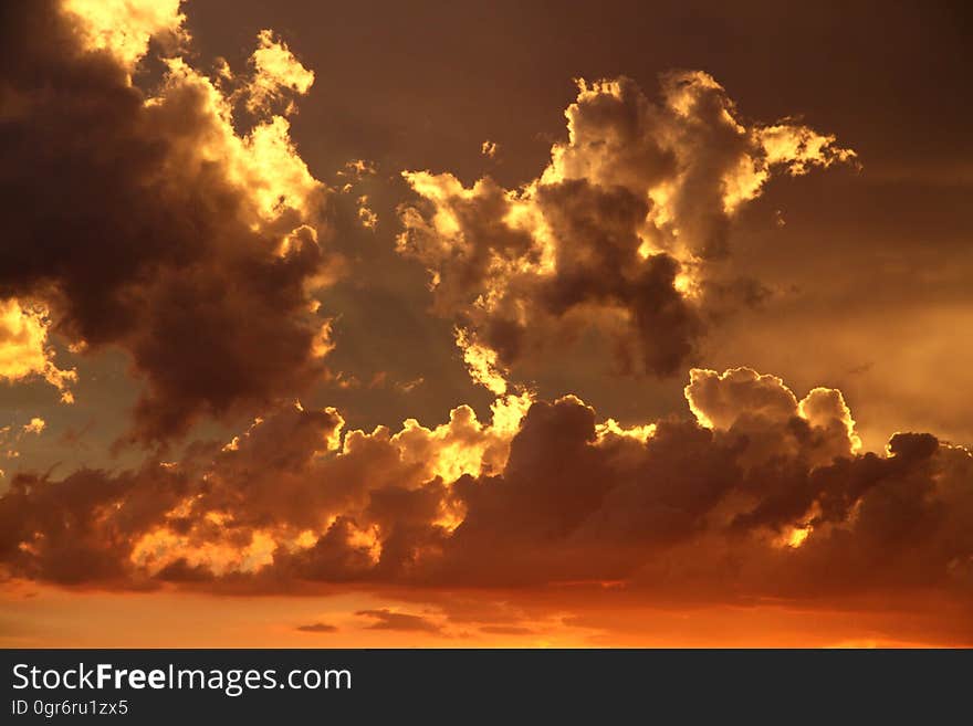 Nimbus Clouds on Clear Blue Sky during Golden Hour