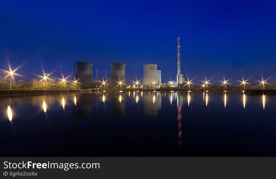 A waterfront lit up at night. A waterfront lit up at night.