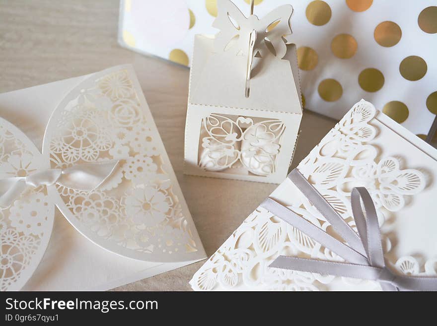 Carved paper decorations on wooden table.