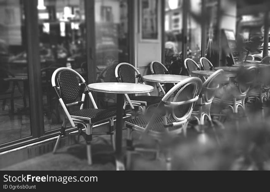 Interior of a cafe with tables and chairs.