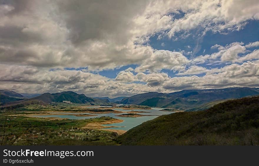 A valley with clouds over it. A valley with clouds over it.