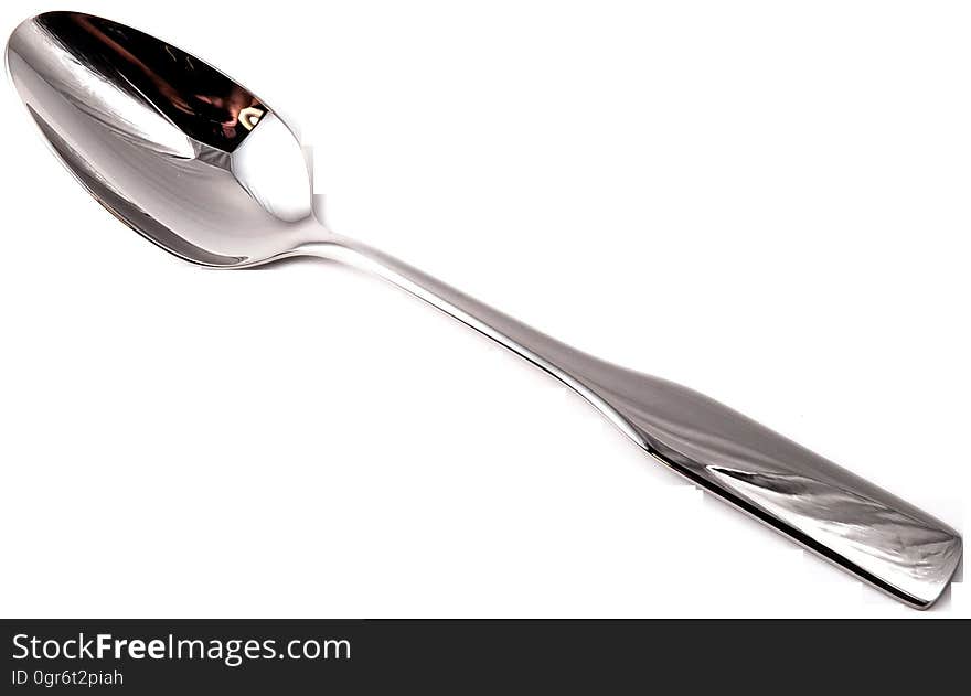 A spoon on a white background. A spoon on a white background.