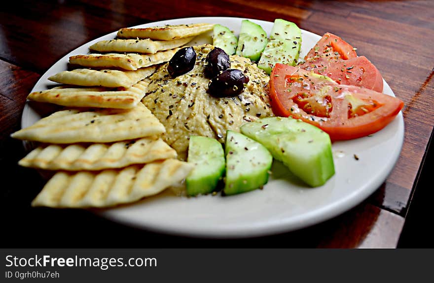 Sliced Tomato With Cucumber and Taco