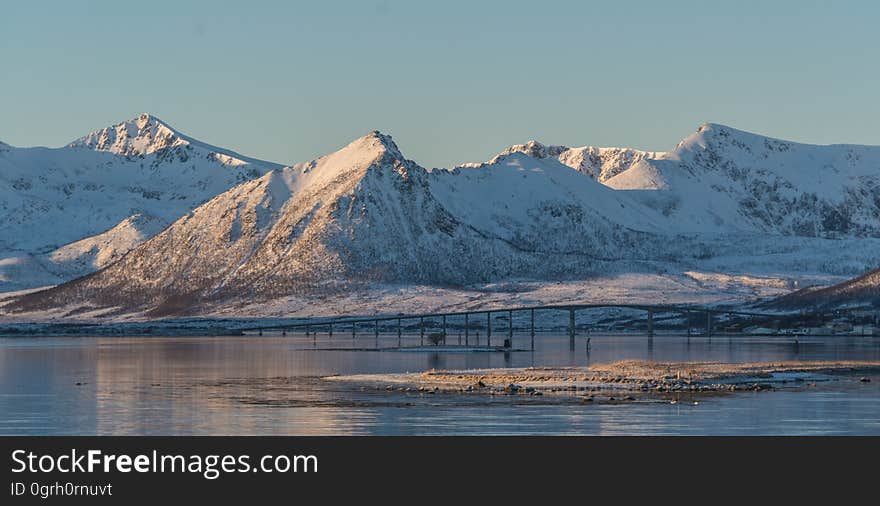 Snowy mountains on the shores.