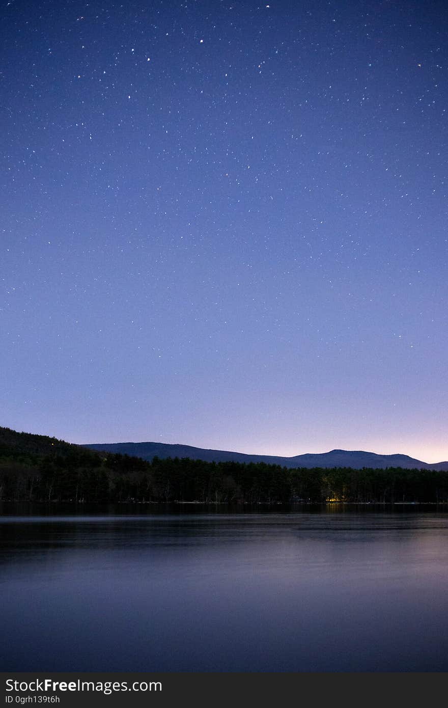 A tranquil lake at dusk.