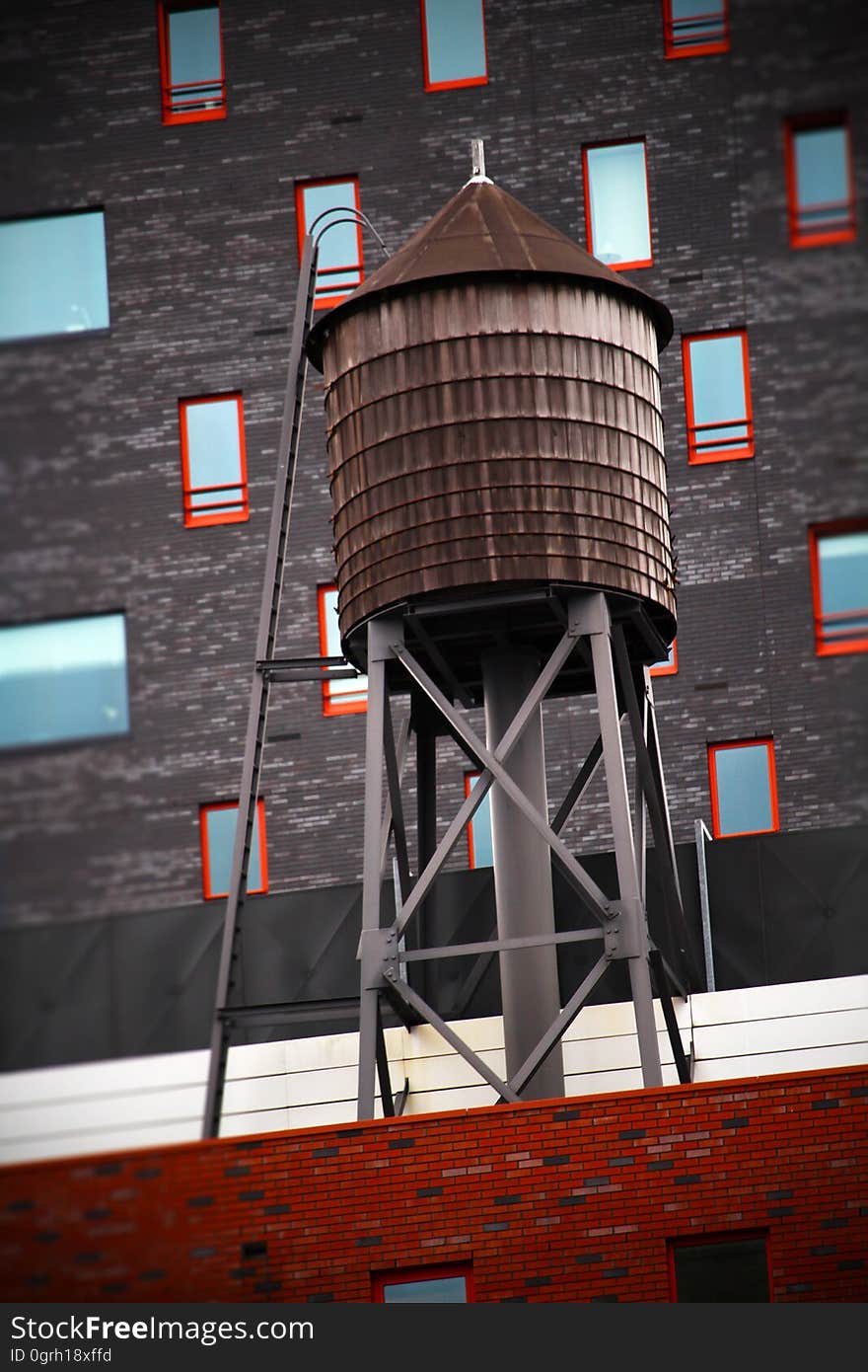 A view of a water tank on top of a building.