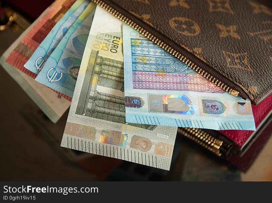 Closeup of a wallet full of Euros.