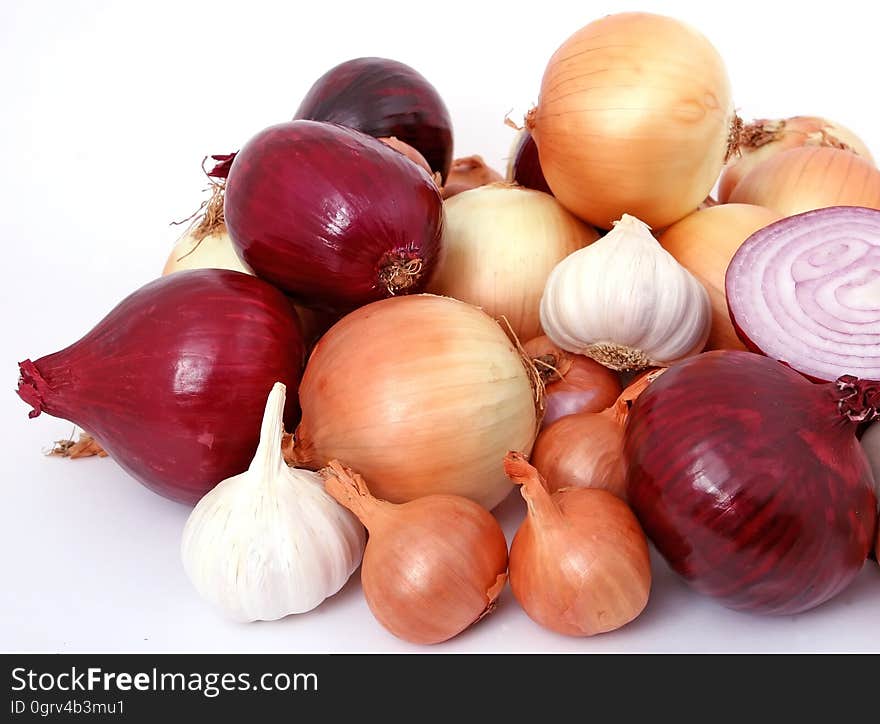 Onion and Garlic on White Surface