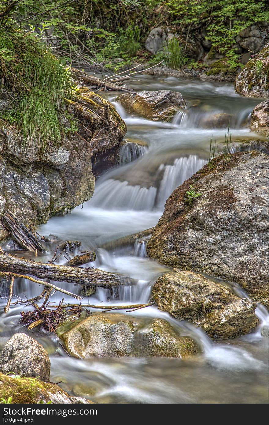 Clear Running Water in the Middle of Brown Stones