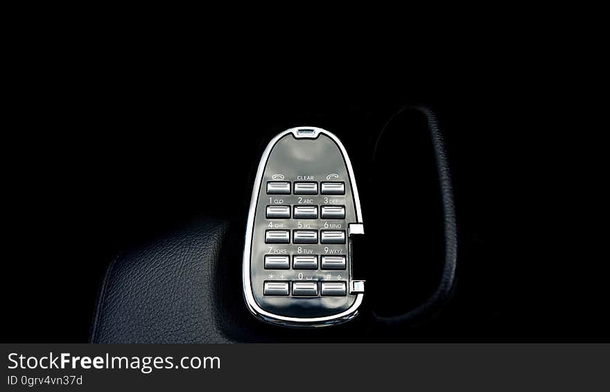 A number pad for telephone on dark background. A number pad for telephone on dark background.