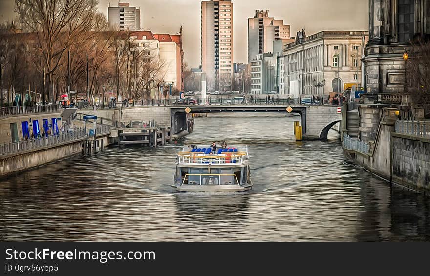 A boat cruising on the river Spree near Schlossplatz in Berlin. A boat cruising on the river Spree near Schlossplatz in Berlin.