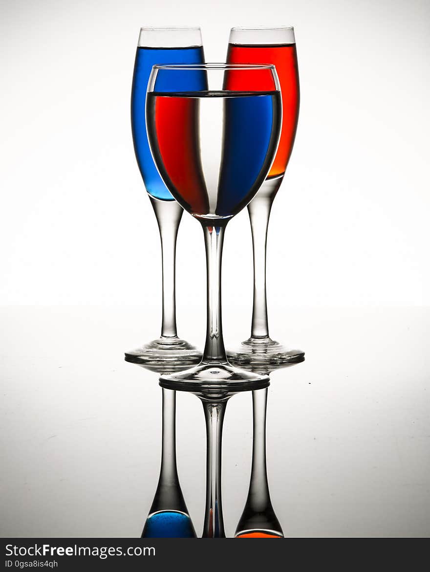 Three glasses with liquid with refraction. Three glasses with liquid with refraction.