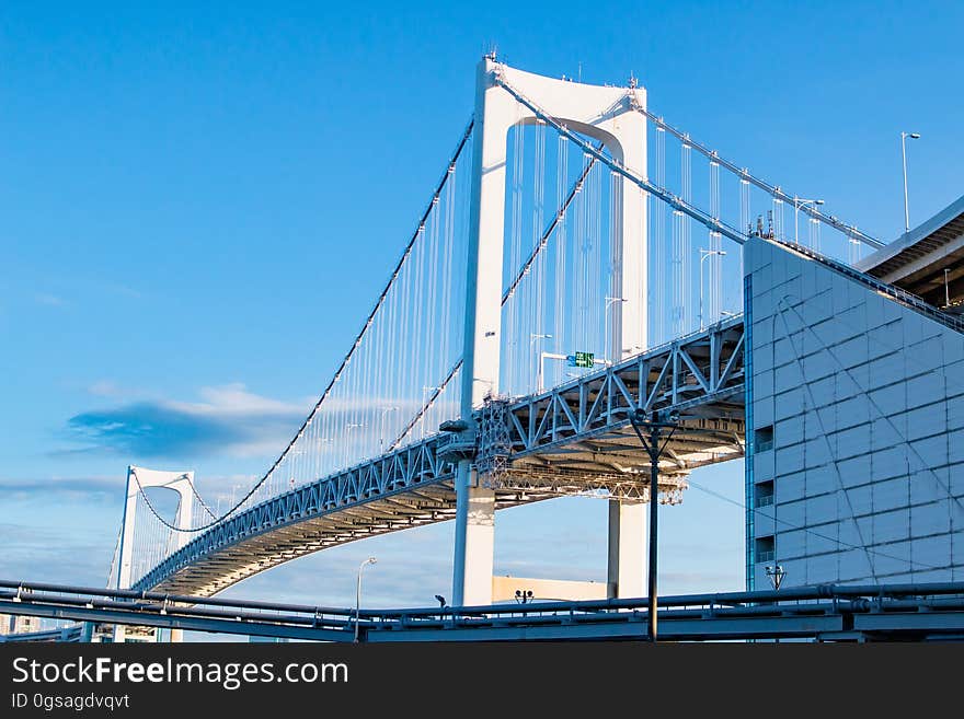 A view of the Rainbow Bridge in Tokyo, Japan, at daytime.