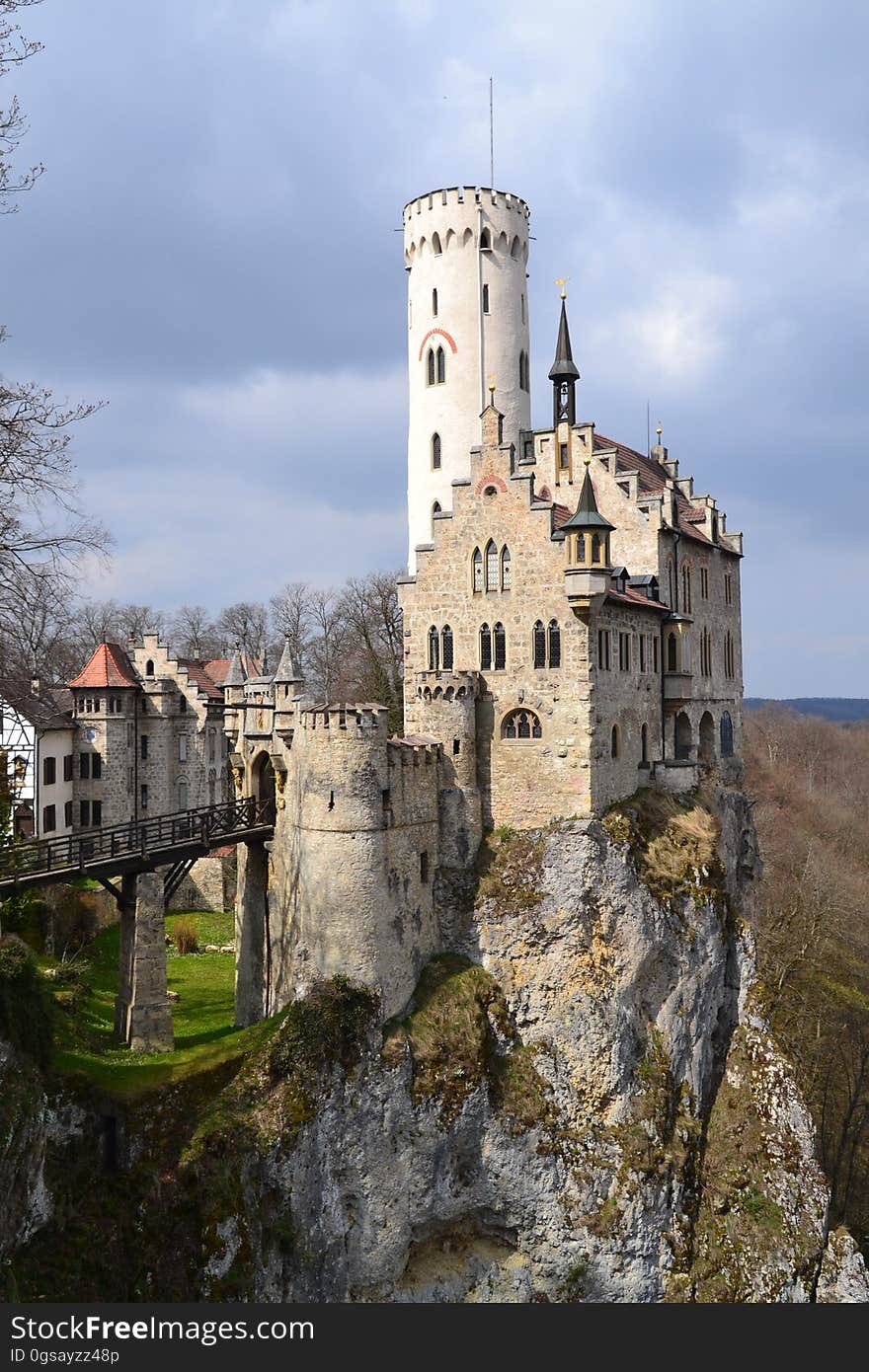 Gray and White Castle Built Near a Cliff