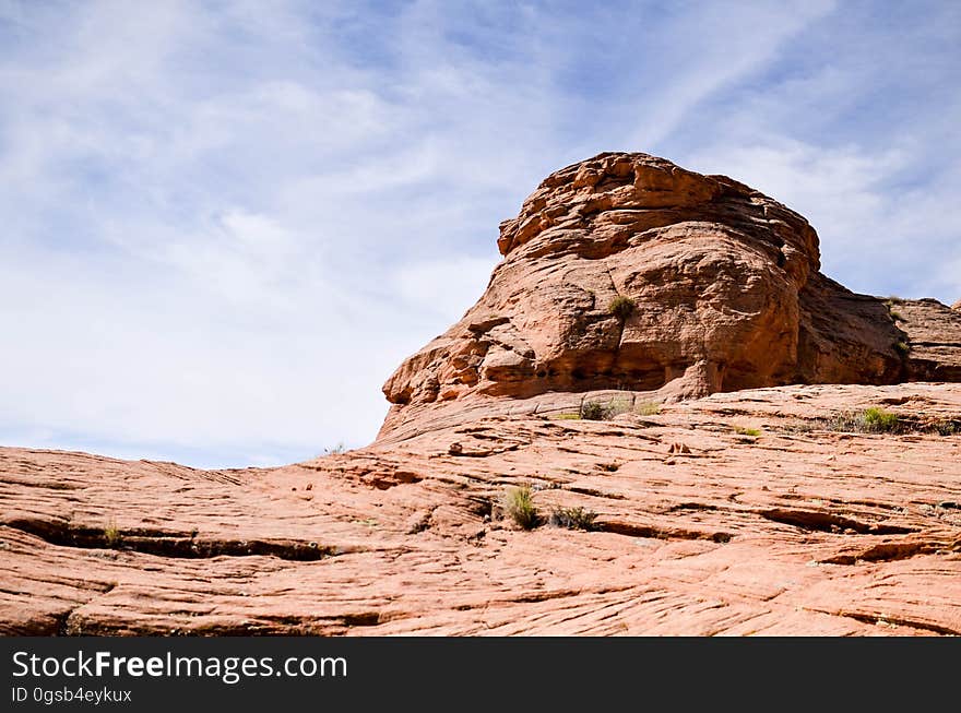 Sandstone rock crag against blue skies on sunny day. Sandstone rock crag against blue skies on sunny day.