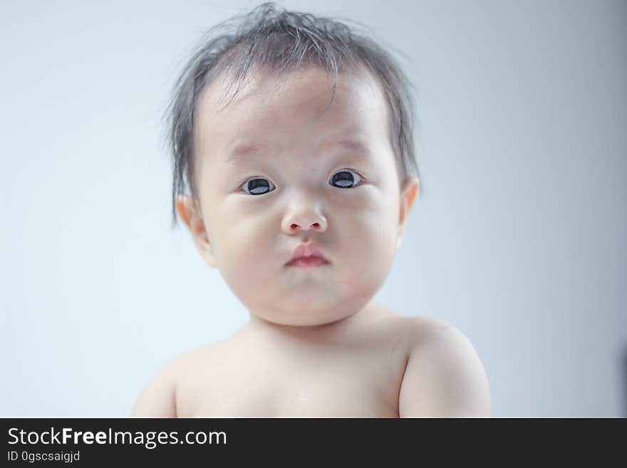 Looking baby in room at home