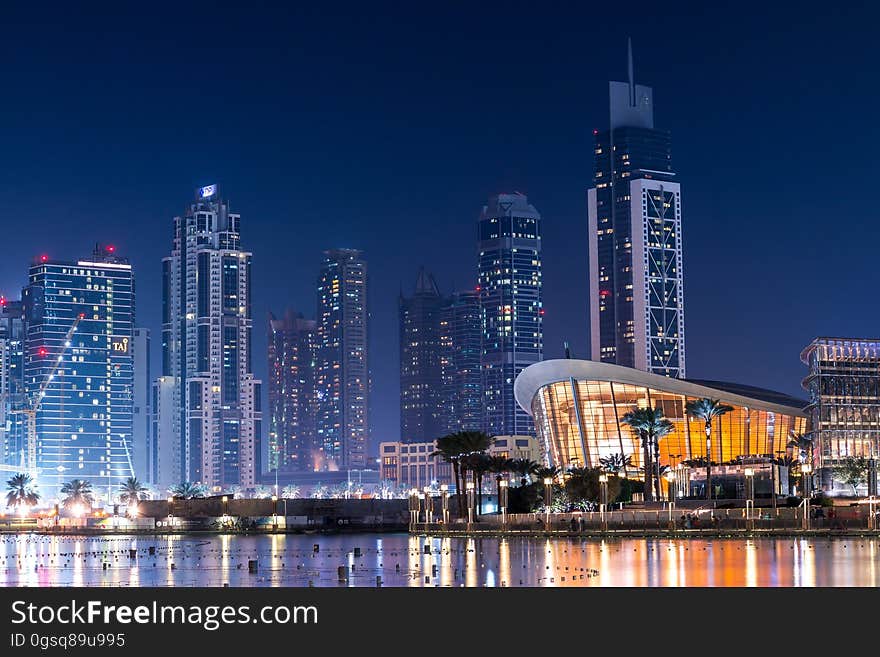 Illuminated waterfront of Dubai, United Arab Emirates at night. Illuminated waterfront of Dubai, United Arab Emirates at night.