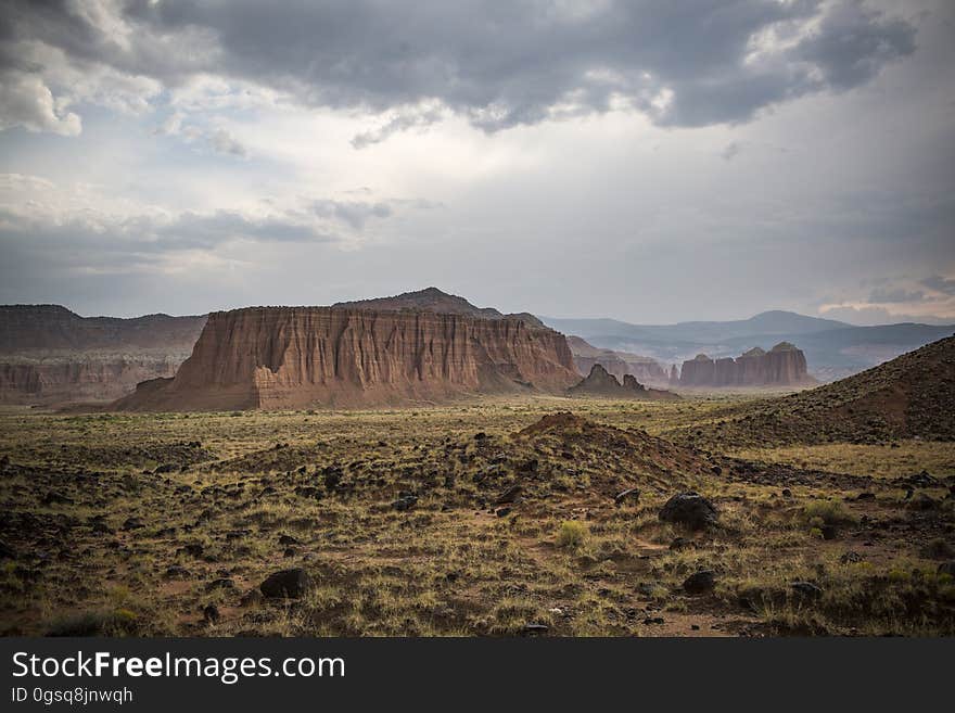 Scenic View of Desert Landscape Against Dramatic Sky