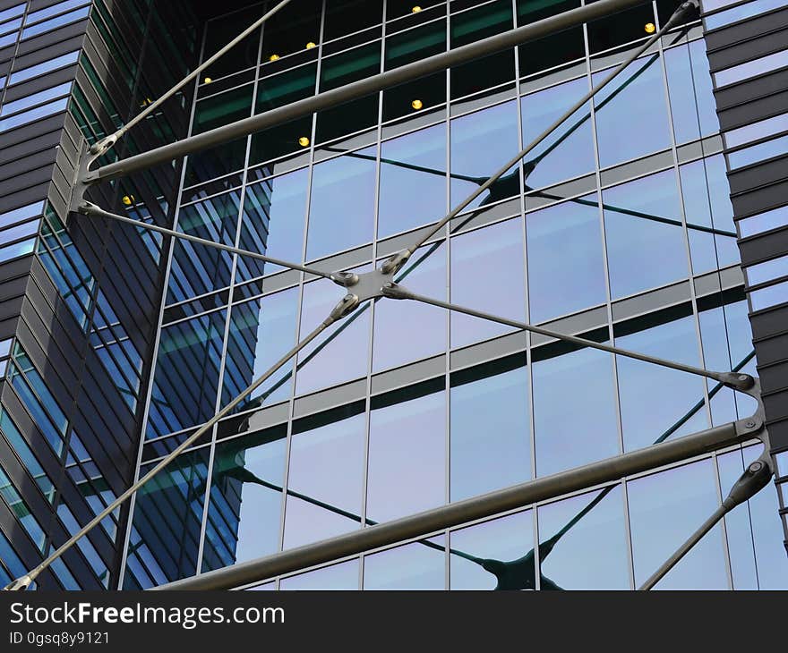 Facade of glass and steel modern building on sunny day.