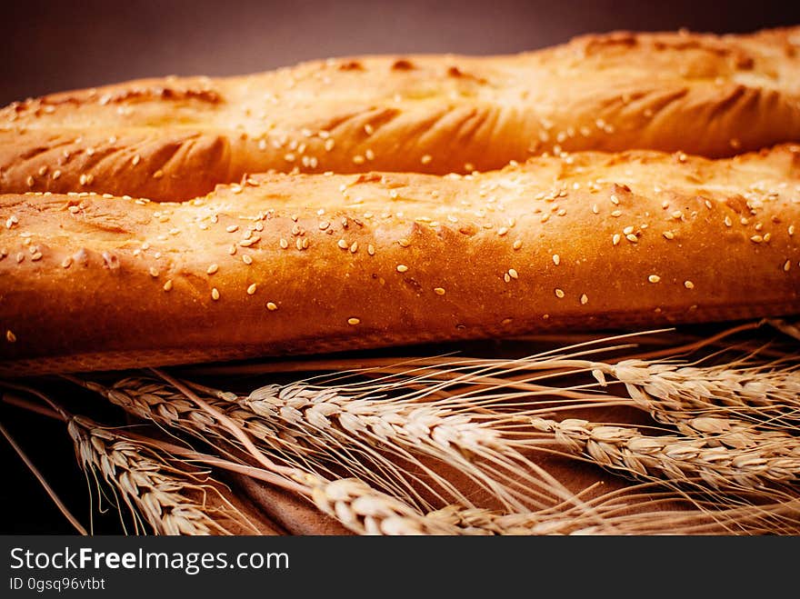 Loaves of fresh baked bread with grains of wheat. Loaves of fresh baked bread with grains of wheat.