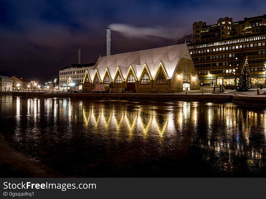 Illuminated skyline illuminated at night reflecting in waterfront in Sweden. Illuminated skyline illuminated at night reflecting in waterfront in Sweden.