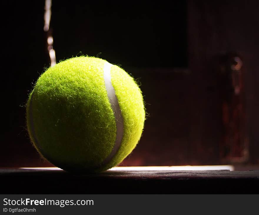 A tennis ball in a ray of sunlight. A tennis ball in a ray of sunlight.