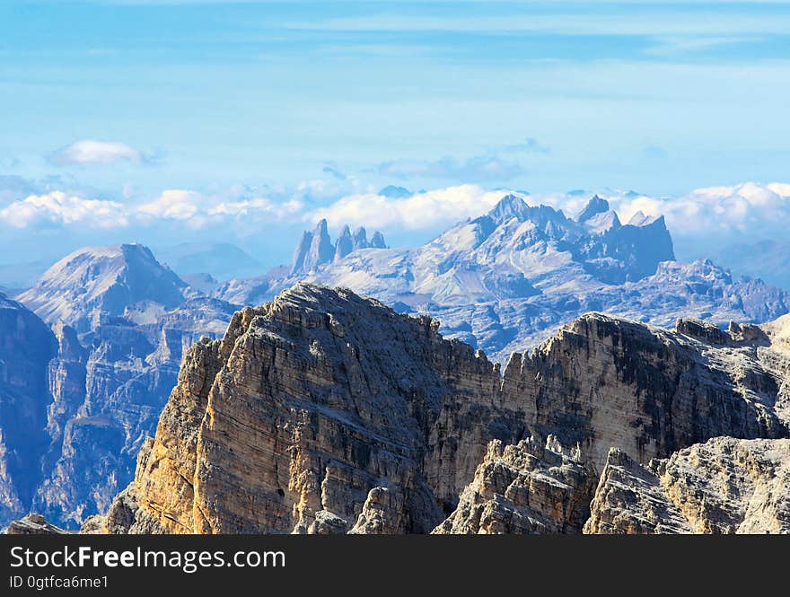 A mountain range and cloudy skies above it.