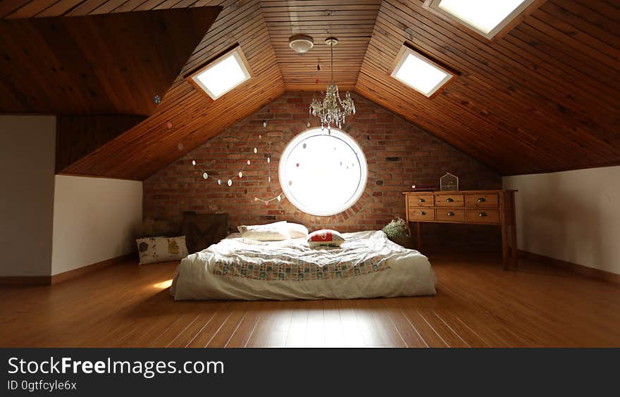 A loft bedroom with skylights.