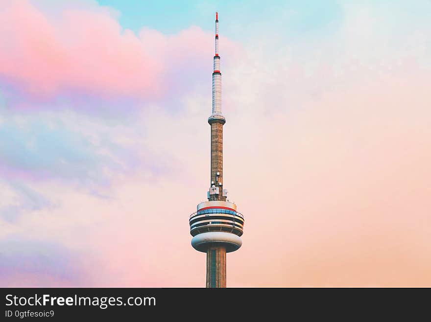 The CN tower against colorful clouds in Toronto, Canada.