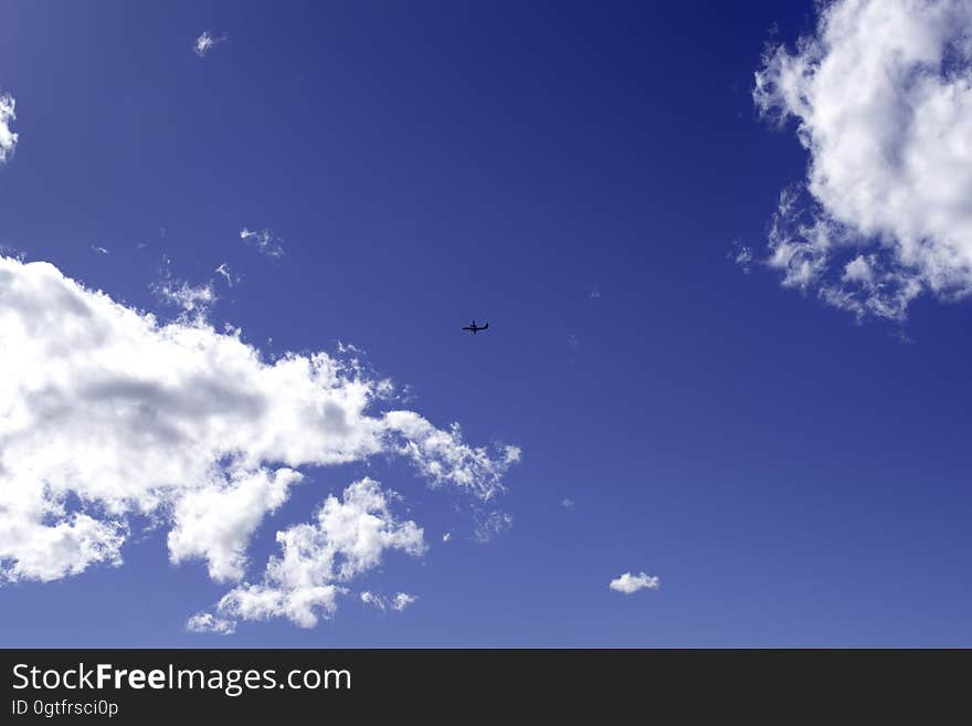 Airplane in the blue sky.