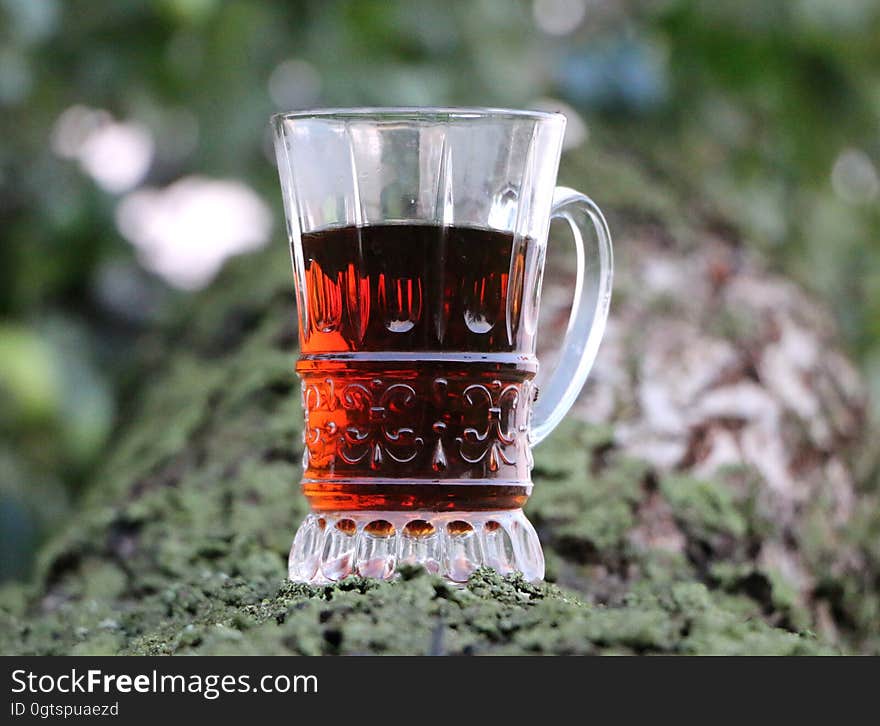 Selective Focus of Clear Glass Mug With Red Liquor