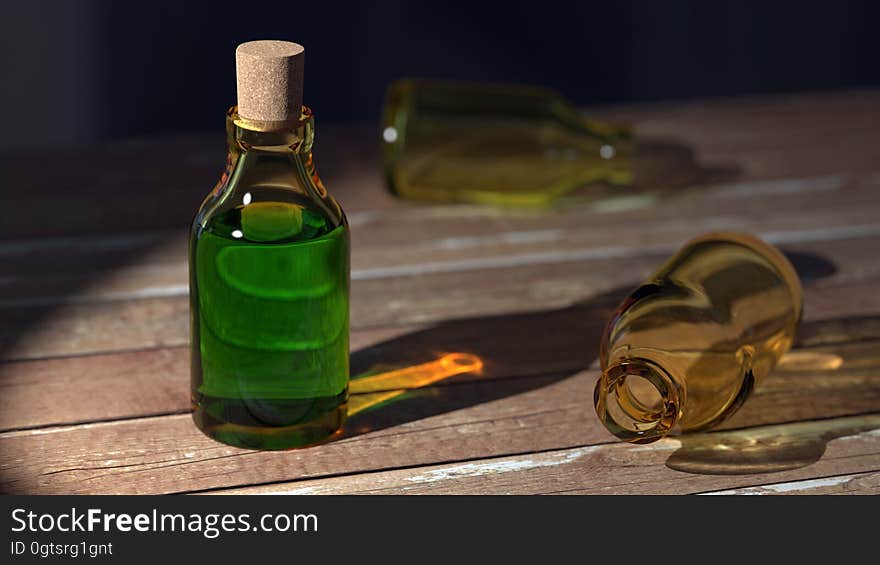 Green Liquid on Clear Glass Bottle With Cork