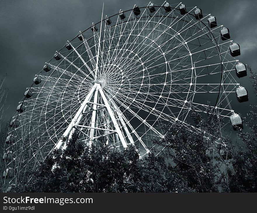 Ferris wheel in amusement park in black and white. Ferris wheel in amusement park in black and white.