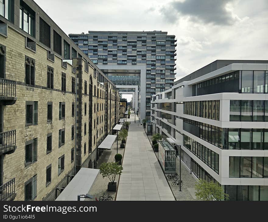 Exterior of modern apartment and office buildings with sidewalk from above. Exterior of modern apartment and office buildings with sidewalk from above.