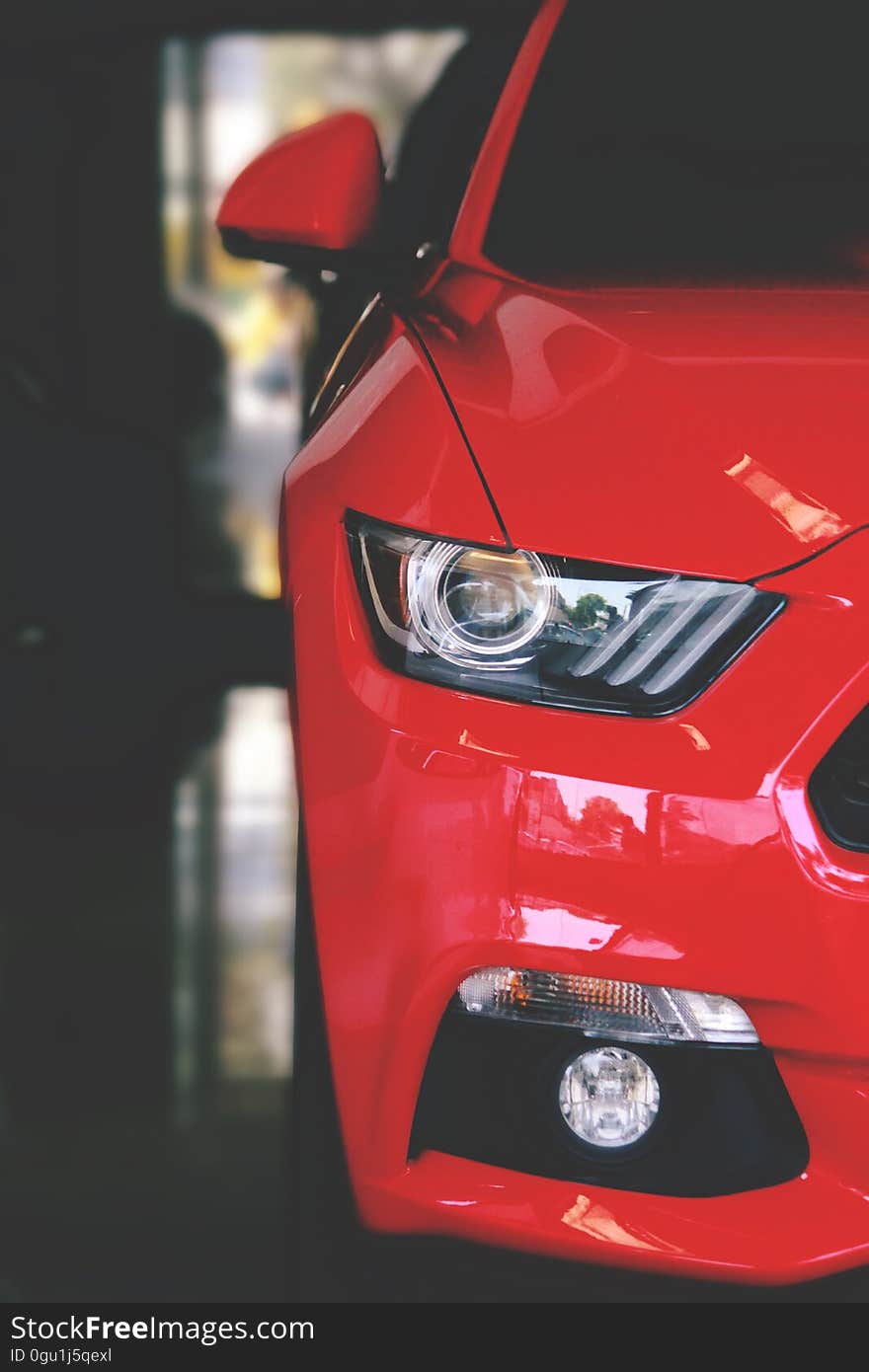 A close up of a modern car front headlights. A close up of a modern car front headlights.