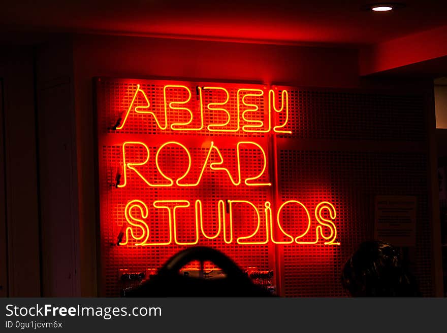 A neon sign with the text "Abbey Road Studios".