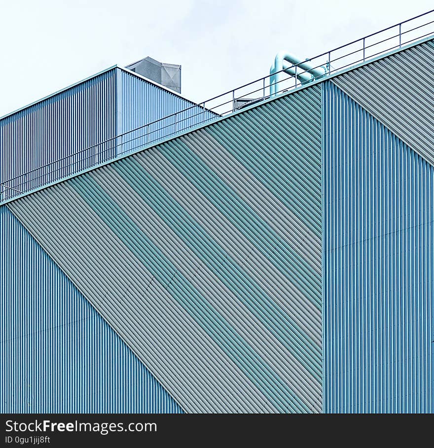 A corrugated steel wall in an industrial facility.