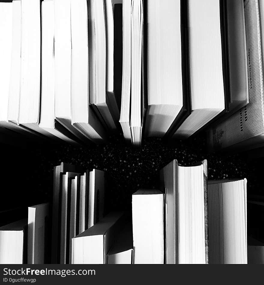 A close up of a pair of stacks of books.