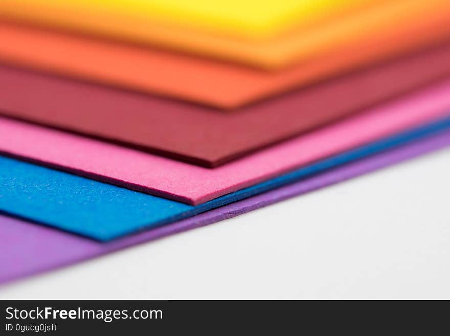 A stack of colorful sheets of paper. A stack of colorful sheets of paper.