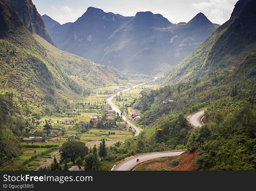 A green valley with road passing through.