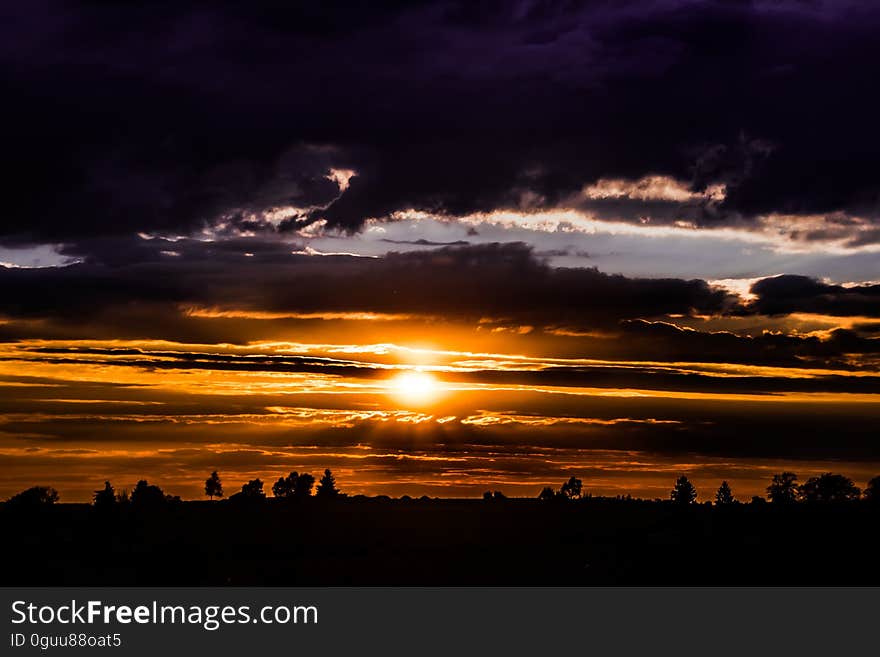 A sunset with dark clouds. A sunset with dark clouds.